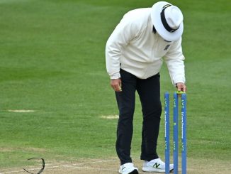 Which current umpire took a wicket with his first ball in Test cricket in 1991?
