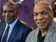Mike Tyson poses for a photo with his great rival Evander Holyfield as he admits ‘we’ve come a long way since the bite fight’, 27 years after he was disqualified for chewing his opponent’s ear in their heavyweight rematch